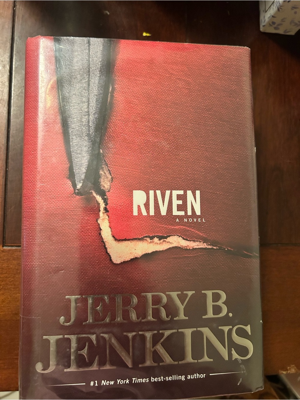 Riven by Jerry B. Jenkins — Hardcover Novel in Red and Black